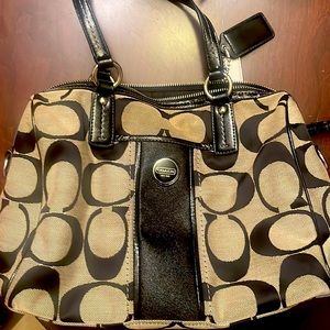Coach purse gently used. Has a zipper in the inside and two small pockets